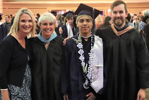 Jair Gamez-Carrasco takes a picture with Nurse Mary Groh, Teacher Laura Beko, and SRO Zach Keirsey.